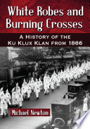 White robes and burning crosses : a history of the Ku Klux Klan from 1866 /
