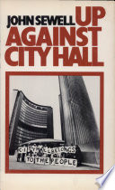 Up against city hall.