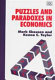 Puzzles and paradoxes in economics /